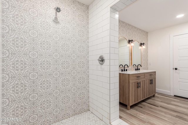 675 Val Verde Cir W, Litchfield Park, AZ 85340 - full bath with tiled shower, vanity, wood finished floors, and wallpapered walls