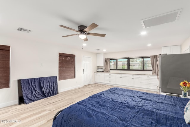 675 Val Verde Cir W, Litchfield Park, AZ 85340 - bedroom featuring freestanding refrigerator, attic access, light wood finished floors, baseboards, and recessed lighting