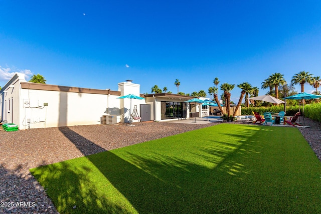 675 Val Verde Cir W, Litchfield Park, AZ 85340 - view of green lawn featuring a patio