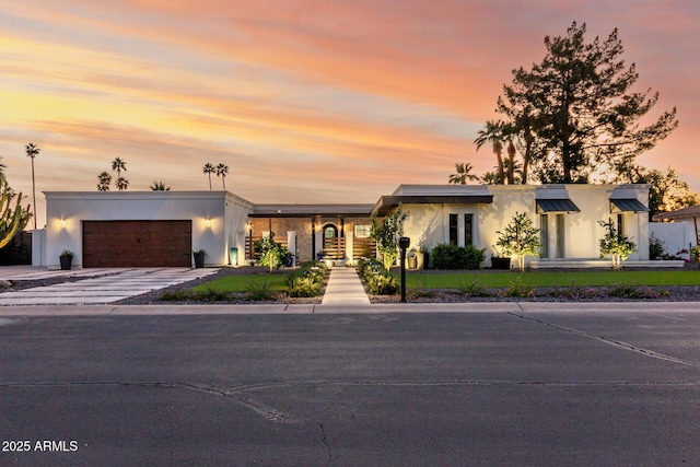 675 Val Verde Cir W, Litchfield Park, AZ 85340 - view of front of home with an attached garage, driveway, and stucco siding