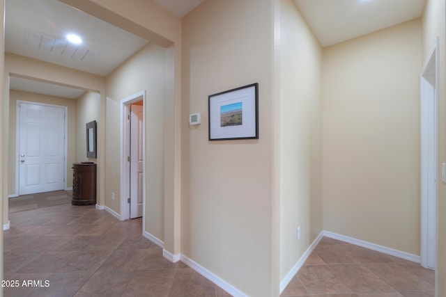 corridor featuring baseboards