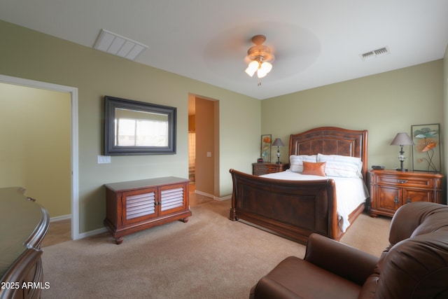 carpeted bedroom with visible vents, ceiling fan, and baseboards