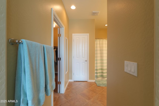 full bathroom featuring recessed lighting, visible vents, a shower with shower curtain, tile patterned flooring, and baseboards