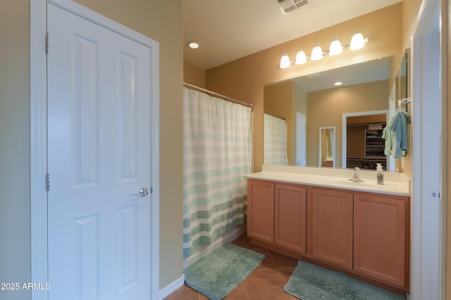 full bathroom with curtained shower, recessed lighting, visible vents, vanity, and tile patterned floors