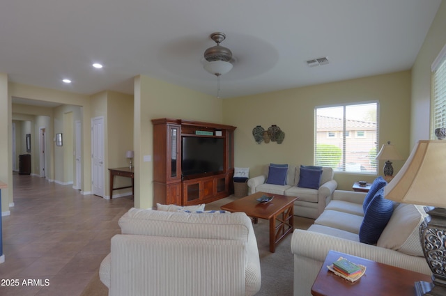 tiled living area with ceiling fan, baseboards, visible vents, and recessed lighting