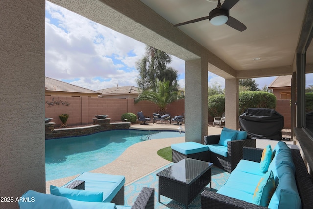 view of swimming pool featuring a patio, a fenced backyard, an outdoor hangout area, a ceiling fan, and a fenced in pool