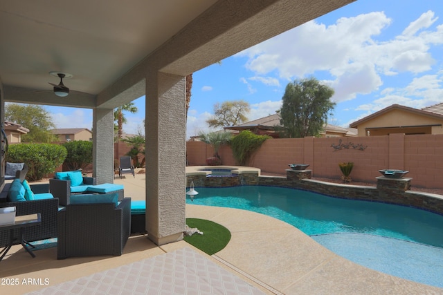 view of swimming pool with a patio, a fenced backyard, an outdoor hangout area, a pool with connected hot tub, and a ceiling fan