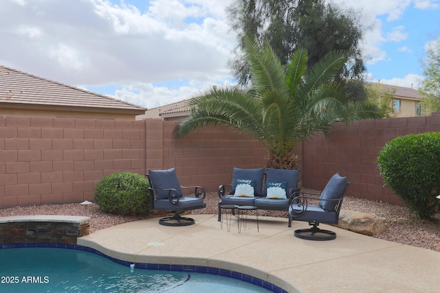 view of pool featuring an outdoor hangout area, a patio area, a fenced backyard, and a fenced in pool