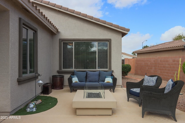 view of patio / terrace with fence and an outdoor living space