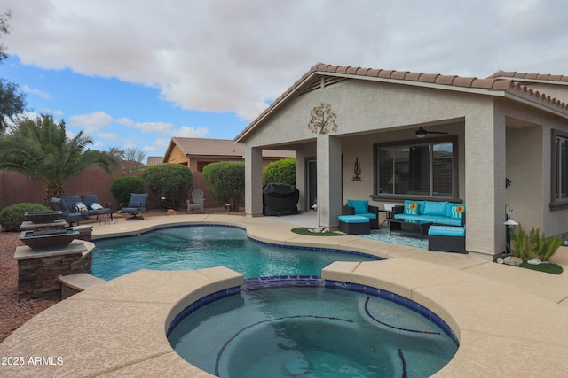 view of swimming pool with a pool with connected hot tub, a patio, an outdoor living space, and fence