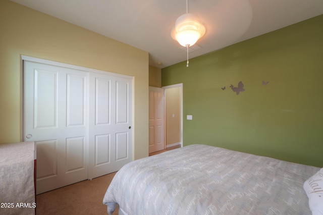 carpeted bedroom with a closet