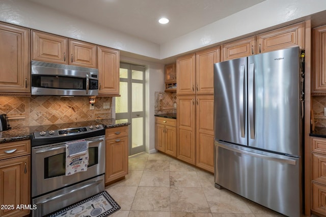 2125 E Elmwood St, Mesa, AZ 85213 - kitchen featuring stainless steel appliances, decorative backsplash, dark stone countertops, light tile patterned floors, and recessed lighting