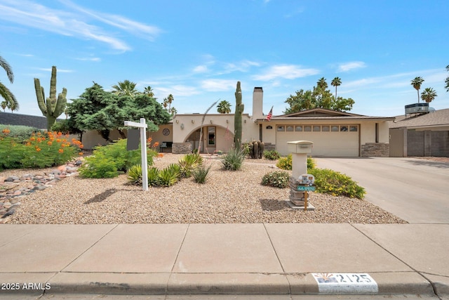 2125 E Elmwood St, Mesa, AZ 85213 - view of front of property featuring stucco siding, an attached garage, concrete driveway, and stone siding