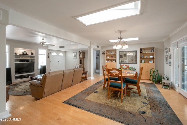 2125 E Elmwood St, Mesa, AZ 85213 - dining room featuring ornate columns, plenty of natural light, wood finished floors, and crown molding