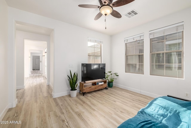 15469 W Dreyfus St, Surprise, AZ 85379 - living room featuring light wood finished floors, baseboards, and ceiling fan