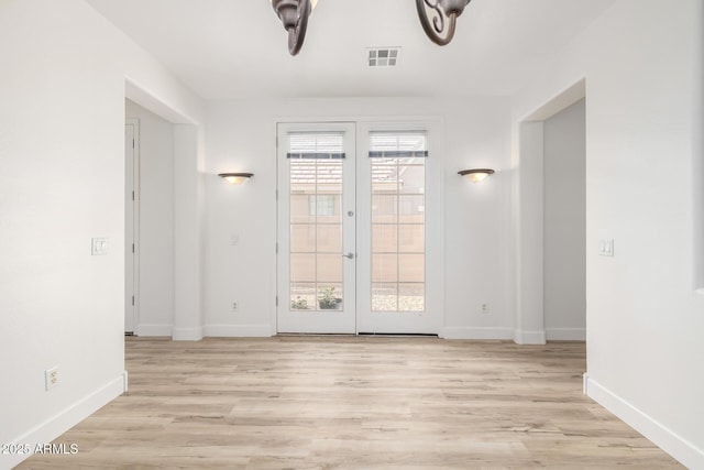 15469 W Dreyfus St, Surprise, AZ 85379 - spare room with french doors, healthy amount of natural light, and baseboards