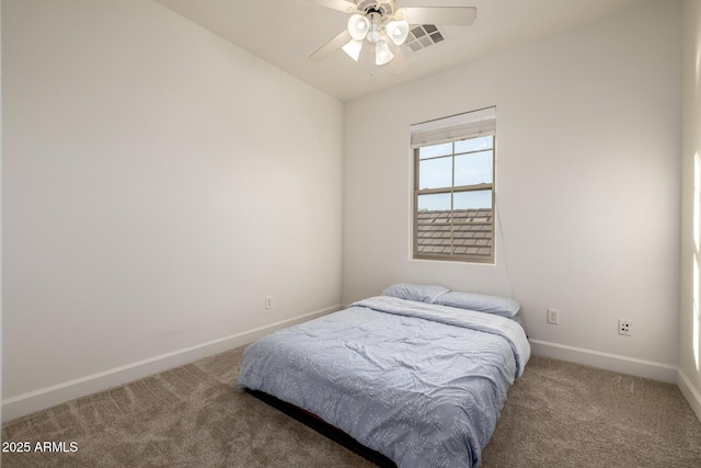 15469 W Dreyfus St, Surprise, AZ 85379 - bedroom with carpet floors, baseboards, and ceiling fan