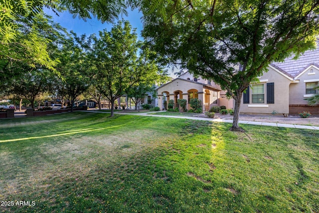 15469 W Dreyfus St, Surprise, AZ 85379 - view of front facade with stucco siding and a front lawn