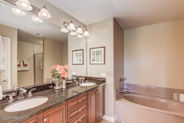 bathroom featuring a bathing tub and vanity