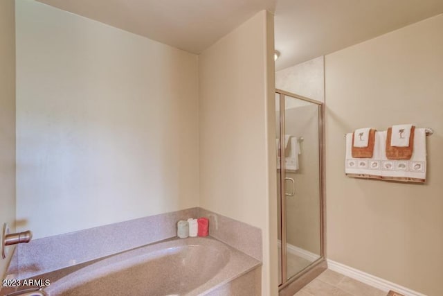 bathroom featuring tile patterned floors and plus walk in shower