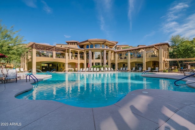 view of swimming pool with a patio