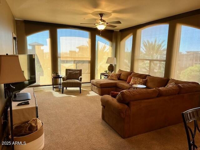 sunroom / solarium with ceiling fan and plenty of natural light