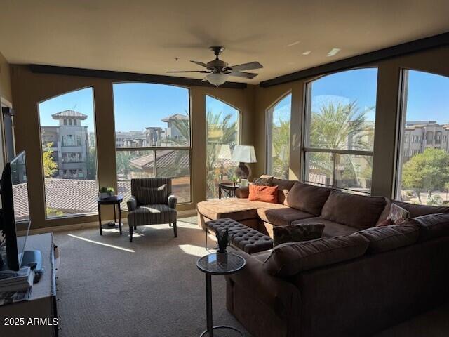 sunroom / solarium with ceiling fan