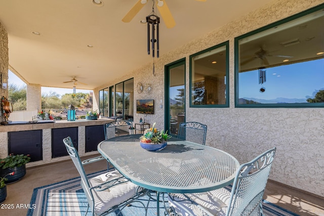 view of patio with ceiling fan