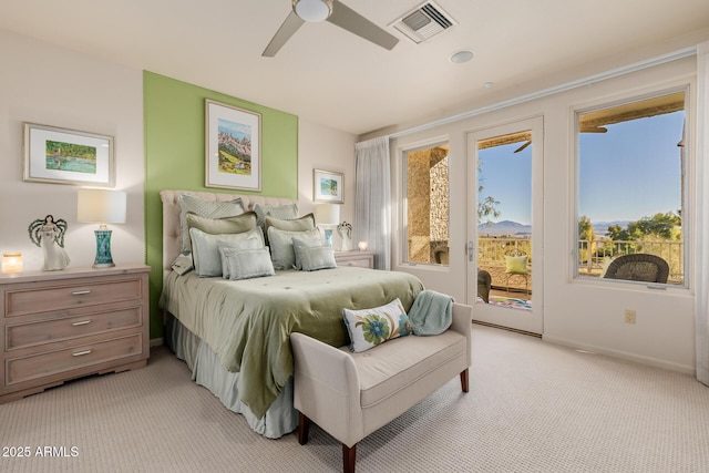 bedroom with ceiling fan, access to exterior, and light carpet