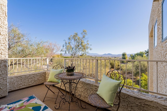 balcony featuring a mountain view