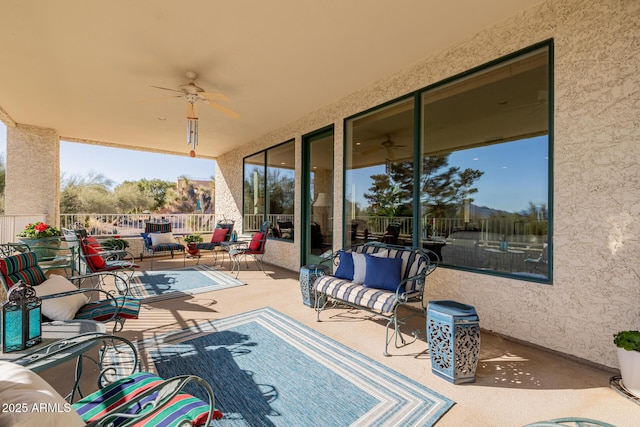 view of patio / terrace with ceiling fan and an outdoor hangout area