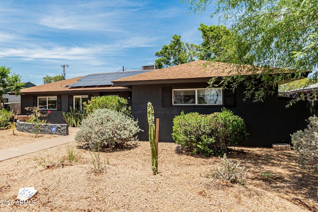 1814 W Thomas Rd, Phoenix, AZ 85015 - ranch-style house with roof mounted solar panels, stucco siding, and roof with shingles