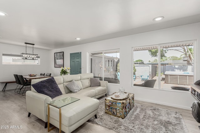 1814 W Thomas Rd, Phoenix, AZ 85015 - living room with light wood-type flooring, a chandelier, and recessed lighting