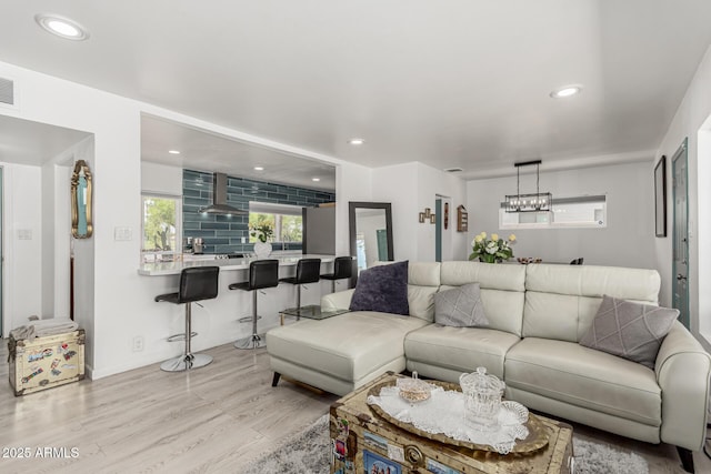 1814 W Thomas Rd, Phoenix, AZ 85015 - living room with wood finished floors, a chandelier, and recessed lighting
