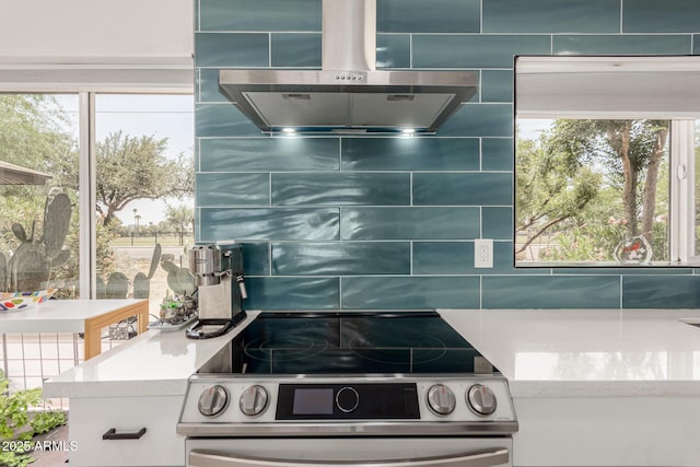 1814 W Thomas Rd, Phoenix, AZ 85015 - kitchen featuring electric range, exhaust hood, tasteful backsplash, and healthy amount of natural light