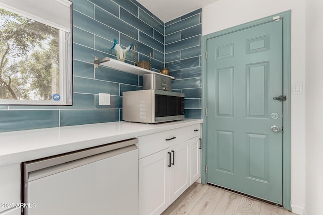 1814 W Thomas Rd, Phoenix, AZ 85015 - bar featuring white appliances, light wood-type flooring, and tasteful backsplash