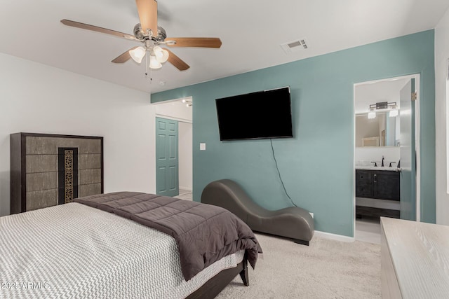 1814 W Thomas Rd, Phoenix, AZ 85015 - bedroom featuring a sink, carpet floors, a ceiling fan, baseboards, and ensuite bath