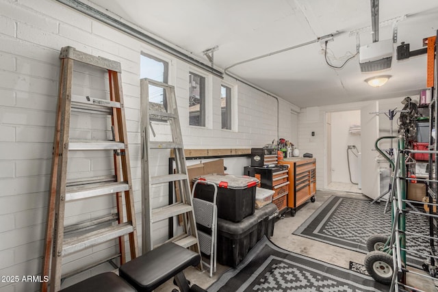 1814 W Thomas Rd, Phoenix, AZ 85015 - garage featuring a garage door opener and concrete block wall