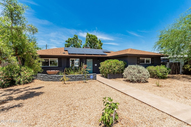 1814 W Thomas Rd, Phoenix, AZ 85015 - single story home featuring solar panels, stucco siding, and a chimney