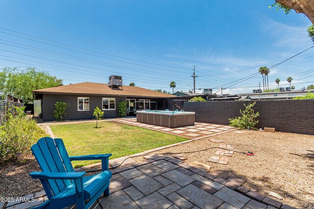 1814 W Thomas Rd, Phoenix, AZ 85015 - back of house featuring a hot tub and a patio area