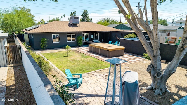 1814 W Thomas Rd, Phoenix, AZ 85015 - back of house with a patio, a fenced backyard, a shingled roof, and solar panels