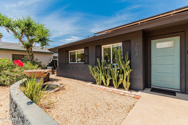 1814 W Thomas Rd, Phoenix, AZ 85015 - doorway to property featuring stucco siding