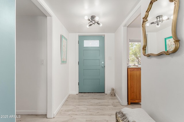 1814 W Thomas Rd, Phoenix, AZ 85015 - entrance foyer with light wood-type flooring and baseboards