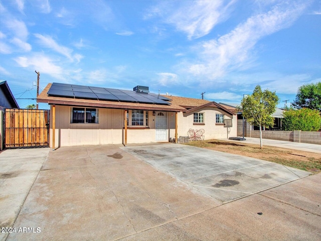 view of front of house with solar panels