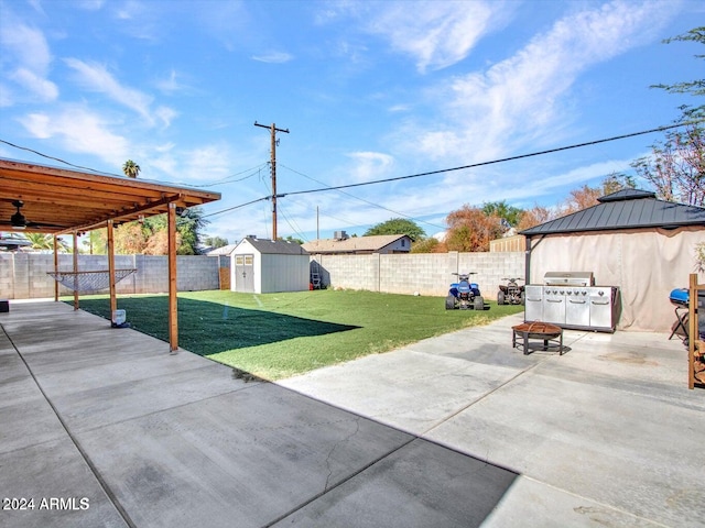 view of patio featuring a gazebo, a storage shed, and grilling area