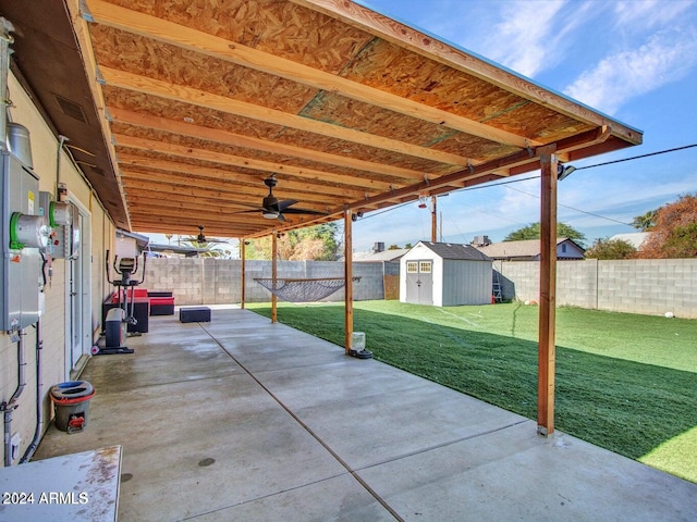 view of patio featuring a shed