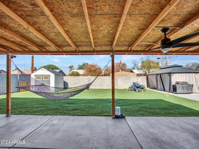 view of patio featuring a gazebo and a storage unit