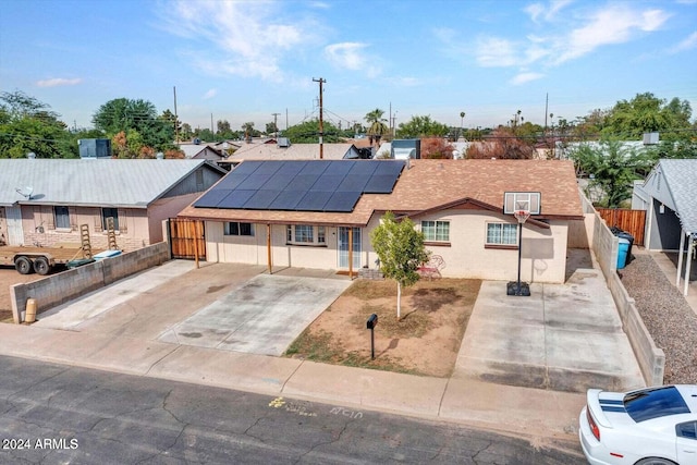 view of front of house with solar panels