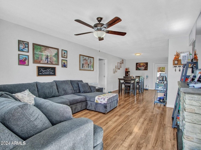 living room with ceiling fan and light hardwood / wood-style floors