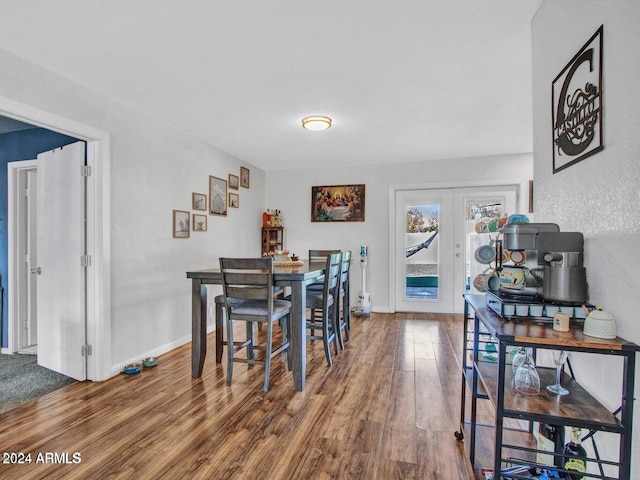 dining space featuring french doors and hardwood / wood-style floors